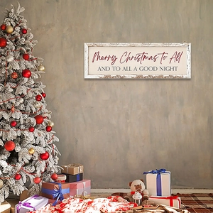 Close-up of wooden Merry Christmas wall plaque hanging in festive holiday home setting