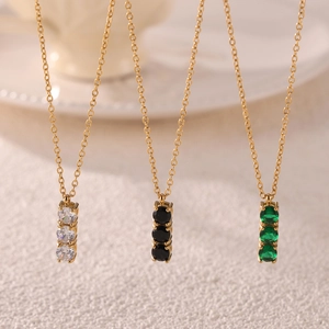 Minimalist gold titanium necklace with three vertical cubic zirconia stones in various colors