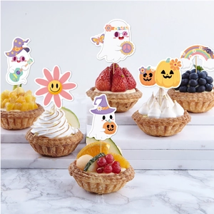 Bohemian Halloween ghost cake toppers with hippie pumpkin and rainbow designs for parties