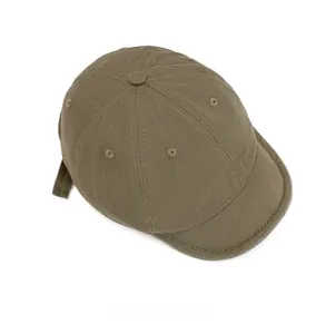 Top view of a vintage dark khaki short brim baseball cap showing six-panel structure