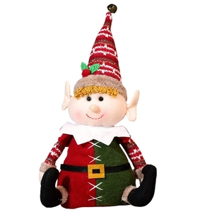 Cute Christmas elf plush doll in red and green festive outfit sitting on white background