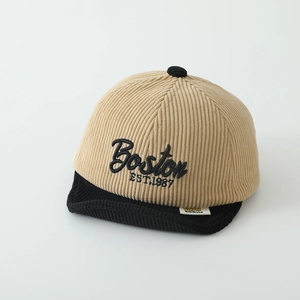 Detailed close-up of corduroy texture and Boston embroidery on the kids baseball cap