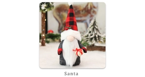 Detail of Christmas gnome with red plaid hat holding a gift box in a snowy scene