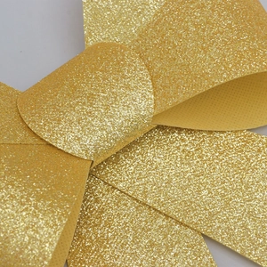 Glittery gold PVC Christmas bow decoration for holiday trees and festive wreaths