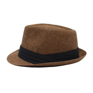 Detailed view of the woven paper straw texture and black fabric band on this trilby hat