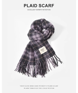 Close-up of taro purple plaid scarf with decorative fringe and GF. ideal brand label