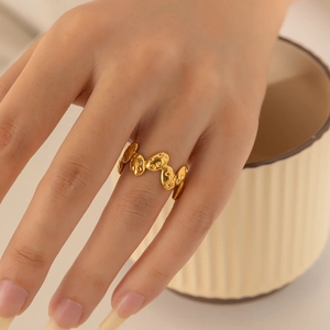 18k gold plated stainless steel geometric textured link ring worn on model finger