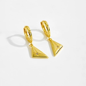 Detail of gold geometric triangle drop earrings with cubic zirconia and star engraving
