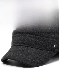 Detail of dark grey tweed flat cap showing stiff brim and precise stitching with metal rivet