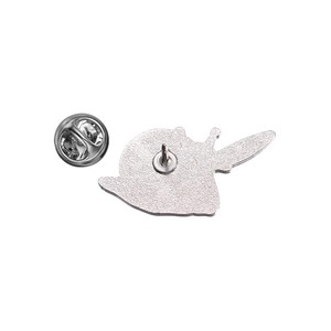 Detail view of the silver metal backing and butterfly clutch on a cute snail enamel pin