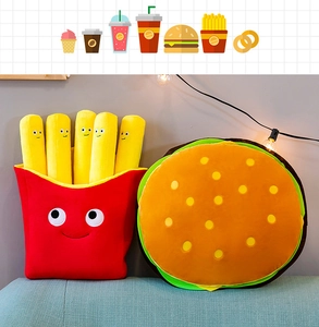 Detailed plush set featuring a soft hamburger and smiling French fries pillows on a sofa