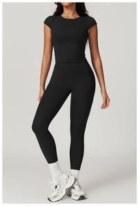 Detail of black seamless compression yoga set with high waist leggings and short sleeve top