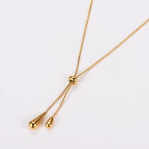 Adjustable Y-shaped gold necklace with teardrop tassels and sliding closure