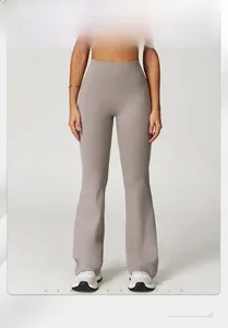 Detail of high-waisted flared yoga pants showing butt-lifting effect and seamless wide waistband