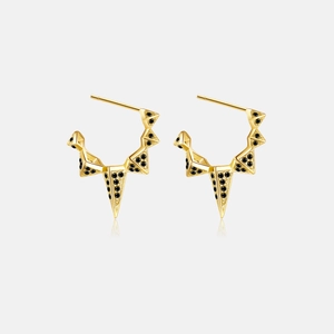 Detail view of 925 silver gold-plated triangle earrings with black stones and micro-pave setting