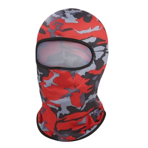 Macro detail of red camo balaclava featuring breathable stretch fabric and eye opening