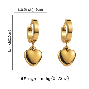 Detail view of gold heart earrings showing dimensions 1.3cm by 2.5cm and 6.6g weight