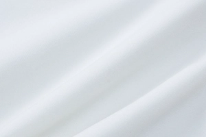 Gros plan sur la dentelle blanche douce et la texture du tissu en maille filet