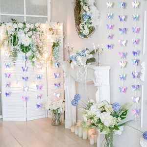 Close-up of holographic 3D butterfly garland hanging in a white romantic party setting