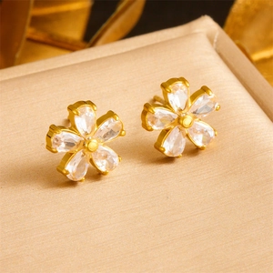 Elegant gold flower stud earrings with five white pear-cut cubic zirconia petals