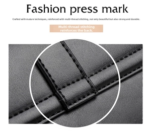 Detailed macro view of reinforced multi-strand stitching on black leather handbag