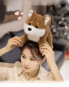 Cute Shiba Inu plush toy on head of model in a warm home setting, soft brown dog doll