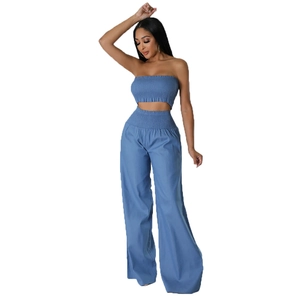 Blue two-piece set featuring a cropped tube top and high-waisted wide-leg trousers