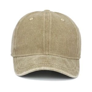 Close-up of washed cotton fabric and embroidered eyelets on a khaki baseball cap