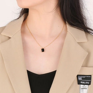 French retro square black glass pendant necklace in gold titanium steel on female model
