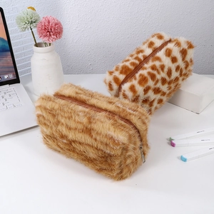 Close-up of plush leopard print and brown faux fur pencil cases with zipper closure