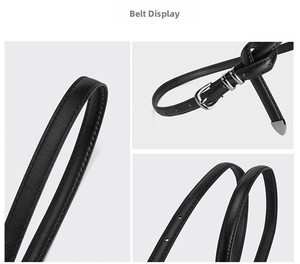 Detail of three black leather belts showing litchi texture and silver pin buckles