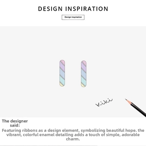 Detail of s925 silver rainbow enamel capsule earrings with artistic sketch props