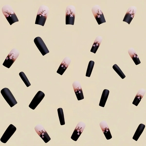 Black to nude pink gradient coffin press-on nails with delicate cherry blossom designs