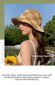 Side view of a woman wearing a plaid woven straw sun hat in a lush outdoor garden