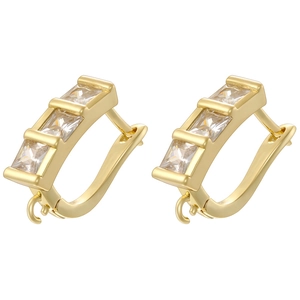 Close-up of gold plated U-shaped earring hooks with three square zircon stones