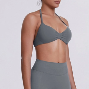 Detail of grey halter sports bra and high waist leggings showing fabric texture and fit