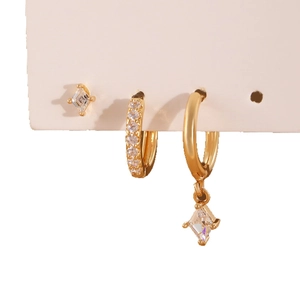 Elegant gold earrings set with diamond rhombic zircon pendants and sparkling hoop earrings