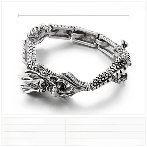 Detailed macro view of retro stainless steel dragon bracelet with engraved scales and links