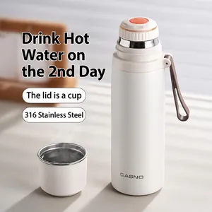 316 stainless steel vacuum insulated bottle with dual-purpose lid and carrying strap