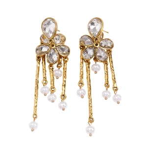 Golden flower drop earrings with crystals and pearl tassels on a white background