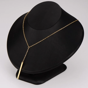 Minimalist gold stainless steel long bar pendant necklace on black bust display