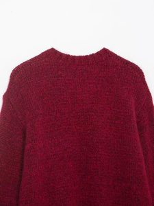 Macro view of burgundy mohair sweater showing ribbed crew neck and fuzzy knit texture