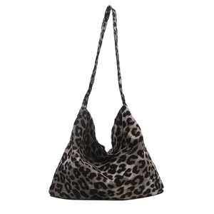 Chic leopard print canvas tote bag with large capacity and stylish wide shoulder strap