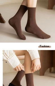 Close-up of brown ribbed knit mid-tube socks showing texture and elasticity details