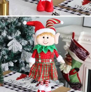 Detailed plush Christmas elf doll with plaid skirt in a cozy festive home setting
