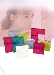 Close-up of velvet jewelry pouches with snap buttons in multiple sizes and vibrant colors