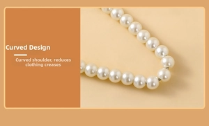 Detail of rounded faux pearl hanger arc design to prevent shoulder bumps on pet clothes