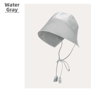 Detail of silk sun hat in water grey with wide brim and elegant satin ribbons
