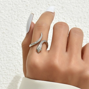 Sparkling silver snake ring with white pavé zircons and black gemstone eyes for women