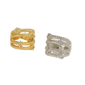 Luxurious gold and silver layered rings featuring star motifs with sparkling zircons